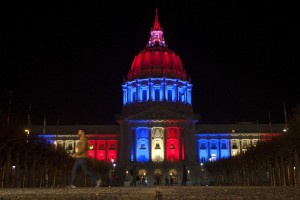 San Francisco City Hall flies the French flag in the wake of the Paris attacks, and its colors are displayed in lights. Photo: Santiago Mejia, Special To The Chronicle